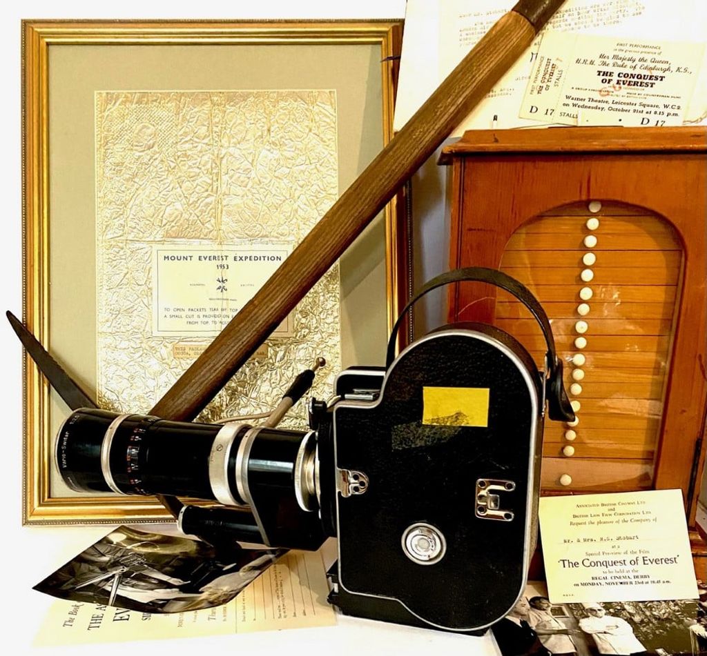 an image shows a tool, a camera, and other mementos from the 1953 Mt. Everest expedition